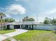 Newly renovated home with modern exterior and driveway at 734 Fortuna Dr, Brandon, FL 33511