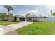 Updated home showcasing a fresh exterior and landscaping at 734 Fortuna Dr, Brandon, FL 33511