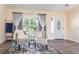 Living room features hardwood floors, two comfy chairs, and a window at 734 Fortuna Dr, Brandon, FL 33511
