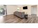 Living room with grey sectional sofa and hardwood floors at 734 Fortuna Dr, Brandon, FL 33511