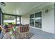 Covered patio with glass sliding doors and seating area at 734 Fortuna Dr, Brandon, FL 33511