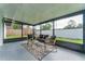 Relaxing screened porch with patio furniture at 734 Fortuna Dr, Brandon, FL 33511