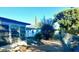 Backyard view showing a gravel area, some trees, and a portion of the house at 7614 Karen Dr, Port Richey, FL 34668