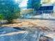Large backyard with a gravel area, some landscaping, and a wooden fence at 7614 Karen Dr, Port Richey, FL 34668