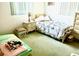 Cozy bedroom with double bed, nightstand and dresser at 7614 Karen Dr, Port Richey, FL 34668