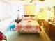 Spacious bedroom with a queen-size bed and ample natural light at 7614 Karen Dr, Port Richey, FL 34668
