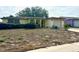 House exterior showcasing a spacious yard at 7614 Karen Dr, Port Richey, FL 34668
