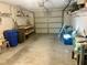 Attached garage with ample storage shelving and space for vehicles at 7614 Karen Dr, Port Richey, FL 34668