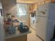 Bright kitchen with white cabinetry and appliances at 7614 Karen Dr, Port Richey, FL 34668
