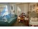 Living room features green couch and recliner at 7614 Karen Dr, Port Richey, FL 34668
