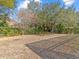 Backyard with mature trees and shrubs at 805 Anchors Way, Tarpon Springs, FL 34689