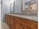 Granite countertop bathroom with double sinks and spacious layout at 805 Anchors Way, Tarpon Springs, FL 34689