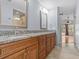 Double vanity bathroom with granite countertop and large mirror at 805 Anchors Way, Tarpon Springs, FL 34689