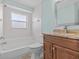 Bathroom with tub, toilet, and vanity with granite top at 805 Anchors Way, Tarpon Springs, FL 34689