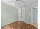 Bedroom with built-in shelving and wood floors at 805 Anchors Way, Tarpon Springs, FL 34689