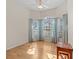 Bright bedroom with hardwood floors and bay window at 805 Anchors Way, Tarpon Springs, FL 34689