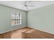 Bright bedroom with wood floors and a ceiling fan at 805 Anchors Way, Tarpon Springs, FL 34689