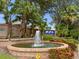 Westwinds community entrance with fountain and landscaping at 805 Anchors Way, Tarpon Springs, FL 34689