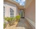Front entrance with double doors and a brick walkway at 805 Anchors Way, Tarpon Springs, FL 34689