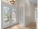 Interior entryway featuring glass double doors and storage at 805 Anchors Way, Tarpon Springs, FL 34689