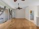 Gathering room with hardwood floors, access to laundry, and ceiling fans at 805 Anchors Way, Tarpon Springs, FL 34689