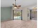 Gathering room featuring tile floors and sliding doors to pool at 805 Anchors Way, Tarpon Springs, FL 34689