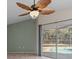 Gathering room with pool view and ceiling fan at 805 Anchors Way, Tarpon Springs, FL 34689