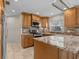 Modern kitchen featuring granite countertops and stainless steel appliances at 805 Anchors Way, Tarpon Springs, FL 34689