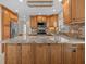 Modern kitchen with granite countertops and stainless steel appliances at 805 Anchors Way, Tarpon Springs, FL 34689