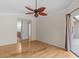 Spacious main bedroom with hardwood floors and ensuite bathroom at 805 Anchors Way, Tarpon Springs, FL 34689