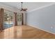 Main bedroom with hardwood floors and access to the backyard at 805 Anchors Way, Tarpon Springs, FL 34689