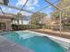 Inviting screened pool with patio at 805 Anchors Way, Tarpon Springs, FL 34689