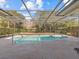 Refreshing screened pool and patio at 805 Anchors Way, Tarpon Springs, FL 34689