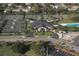 Aerial view of tennis courts, clubhouse, and pool at 8256 Annwood Rd # 8256, Seminole, FL 33777