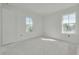 Bright bedroom with white walls and two windows at 870 29Th N Ave, St Petersburg, FL 33704