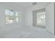 Bedroom features bright natural light, fresh paint, and an open doorway to another room at 870 29Th N Ave, St Petersburg, FL 33704