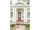 Charming front porch features a stylish hanging lantern and craftsman-style columns, complementing the exterior at 870 29Th N Ave, St Petersburg, FL 33704