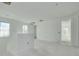 Hallway featuring bright natural light from a window and an open doorway to another room at 870 29Th N Ave, St Petersburg, FL 33704