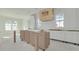 Bright kitchen with a custom wood range hood and modern white cabinetry being installed at 870 29Th N Ave, St Petersburg, FL 33704