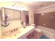 Bathroom featuring a vanity with sink, vanity mirror and shower with curtain at 100 Bluff View Dr # 401A, Belleair Bluffs, FL 33770