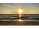 Gorgeous sunset scene over sandy beach, creating a serene and picturesque coastal experience at 100 Bluff View Dr # 401A, Belleair Bluffs, FL 33770
