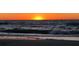 Vibrant sunset over the ocean, with waves crashing on the beach at 100 Bluff View Dr # 401A, Belleair Bluffs, FL 33770
