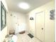 Bright entryway with tile floors, decor, and white door leading into the home at 100 Bluff View Dr # 401A, Belleair Bluffs, FL 33770