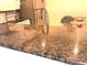 Close up of granite countertops with a stainless steel sink in a kitchen at 100 Bluff View Dr # 401A, Belleair Bluffs, FL 33770