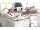 Comfortable living space featuring a sectional sofa, TV, and soft lighting at 100 Bluff View Dr # 401A, Belleair Bluffs, FL 33770