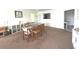 Inviting living and dining area with neutral tones, offering a comfortable and versatile living space with natural light at 100 Bluff View Dr # 401A, Belleair Bluffs, FL 33770