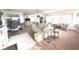 Bright, open living area with a comfortable sofa, desk space, and ample natural light at 100 Bluff View Dr # 401A, Belleair Bluffs, FL 33770