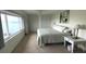 Spacious main bedroom with water views and large bed at 100 Bluff View Dr # 401A, Belleair Bluffs, FL 33770