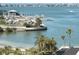 Picturesque view of a marina with boats, docks, and palm trees near the waterfront at 100 Bluff View Dr # 401A, Belleair Bluffs, FL 33770