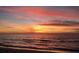 Stunning sunset over the ocean with vibrant colors at 100 Bluff View Dr # 401A, Belleair Bluffs, FL 33770